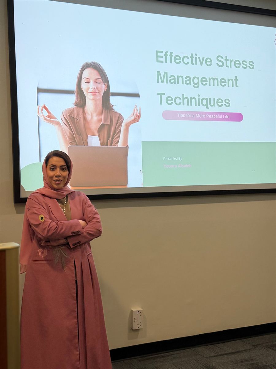 Yousra presenting a workshop on effective stress management techniques